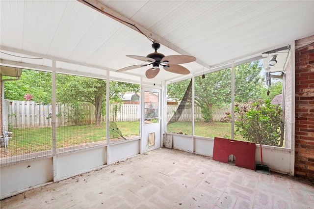 unfurnished sunroom with plenty of natural light and ceiling fan