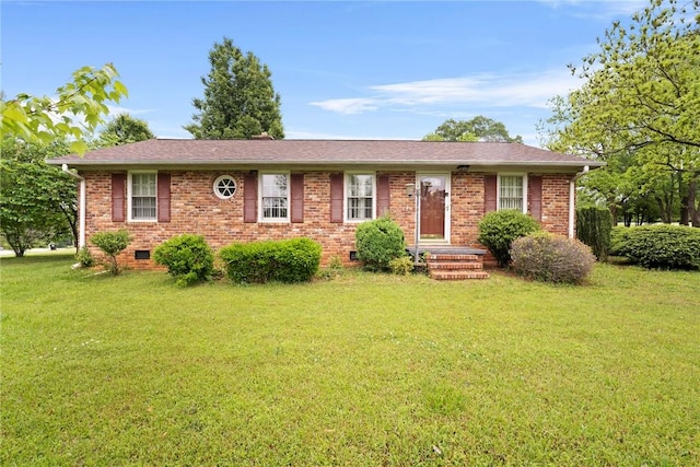ranch-style home with brick siding, a shingled roof, a front lawn, and crawl space