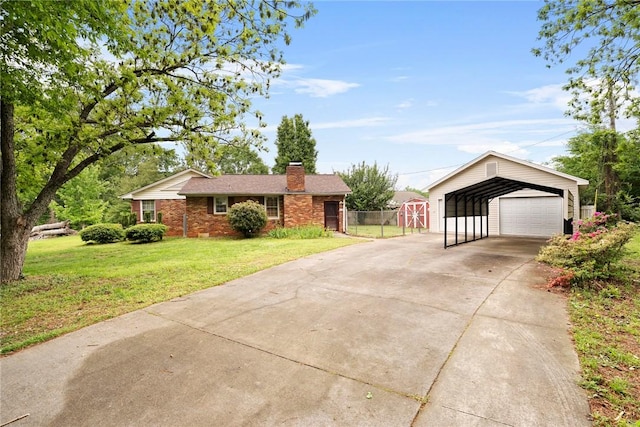 ranch-style home with fence, a front yard, a chimney, driveway, and a carport