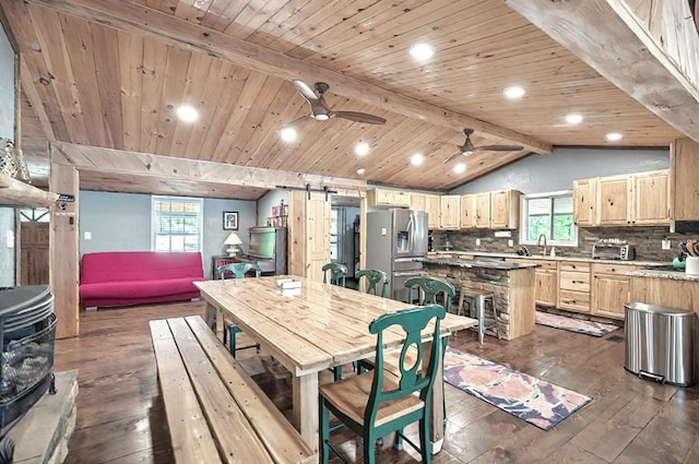 dining area with a ceiling fan, dark wood finished floors, a healthy amount of sunlight, and recessed lighting