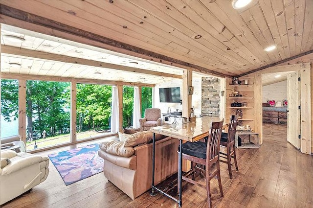 dining space with lofted ceiling, wood ceiling, and hardwood / wood-style flooring