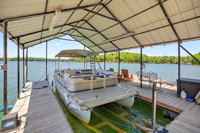 dock area with a water view and boat lift