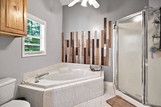 bathroom featuring toilet, a ceiling fan, a bath, and a stall shower