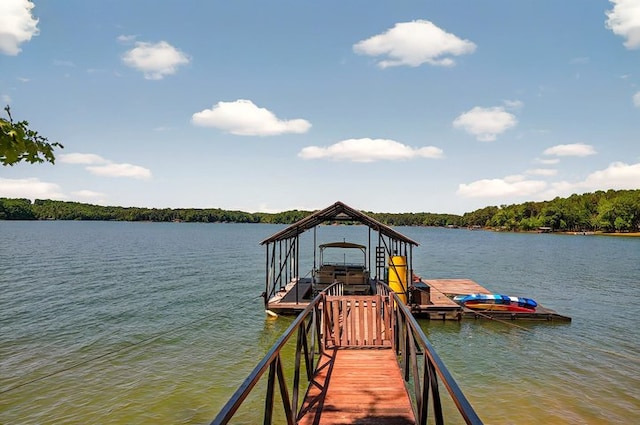 view of dock featuring boat lift and a water view