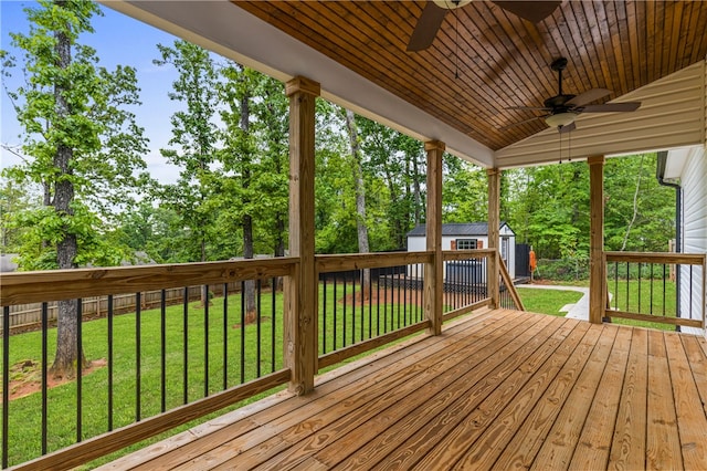 604 Robin Hood Ln, Anderson, SC 29621 - wooden terrace featuring a lawn, a ceiling fan, a shed, and an outbuilding