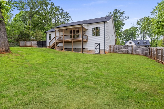 604 Robin Hood Ln, Anderson, SC 29621 - back of property featuring a fenced backyard, a ceiling fan, a lawn, and stairway