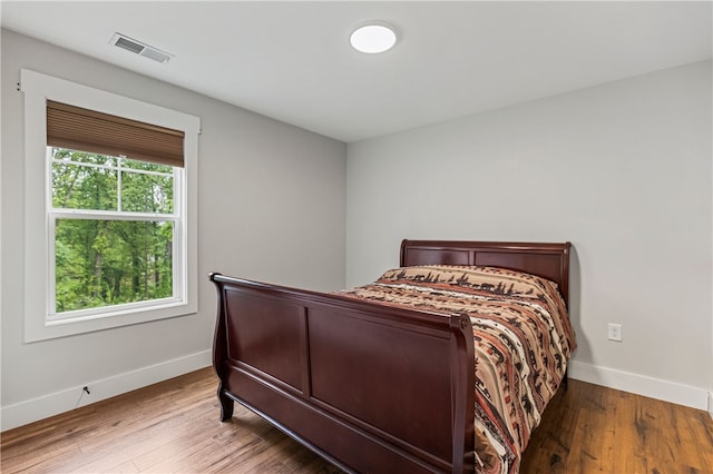 604 Robin Hood Ln, Anderson, SC 29621 - bedroom with baseboards, wood finished floors, and visible vents