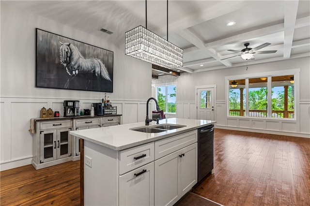604 Robin Hood Ln, Anderson, SC 29621 - kitchen with beam ceiling, a sink, a decorative wall, dishwasher, and dark wood finished floors