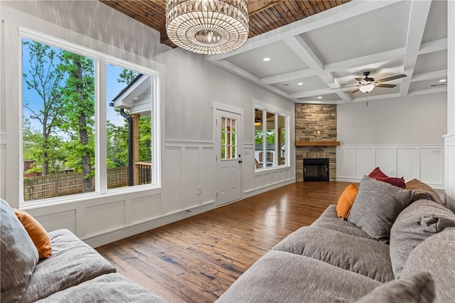 604 Robin Hood Ln, Anderson, SC 29621 - living area with wood finished floors, beam ceiling, a decorative wall, a stone fireplace, and coffered ceiling
