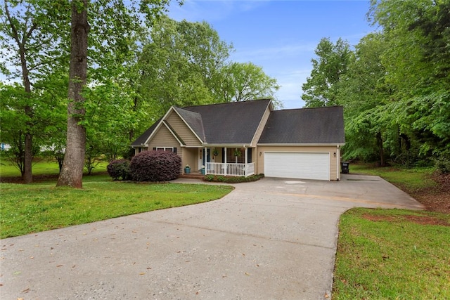 712 Sunny Shore Ln, Anderson, SC 29621 - view of front facade with covered porch, concrete driveway, a front yard, and a garage