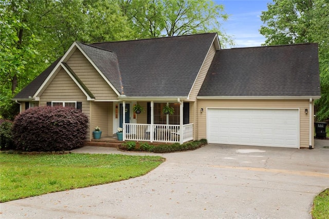 712 Sunny Shore Ln, Anderson, SC 29621 - view of front of house featuring a shingled roof, an attached garage, a front lawn, covered porch, and driveway