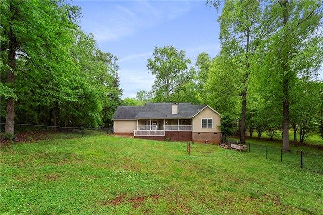 712 Sunny Shore Ln, Anderson, SC 29621 - back of house featuring a lawn, crawl space, a fenced backyard, and a sunroom
