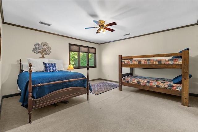 carpeted bedroom featuring visible vents, ornamental molding, and baseboards