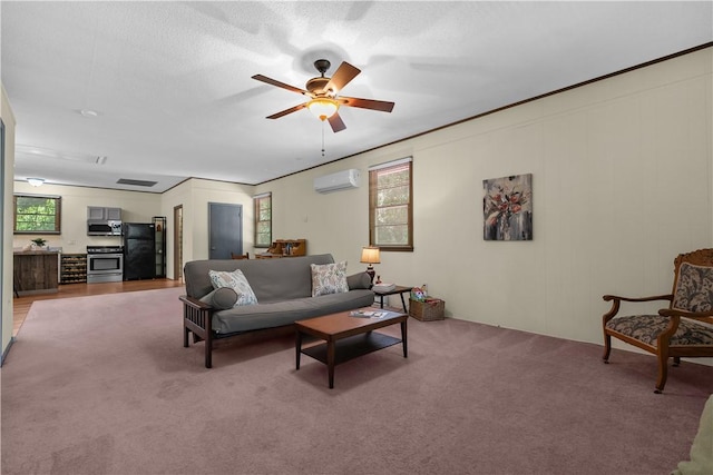 living area featuring carpet, ceiling fan, and a wall mounted AC