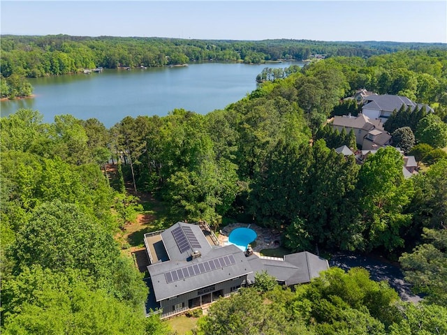 aerial view featuring a water view and a forest view