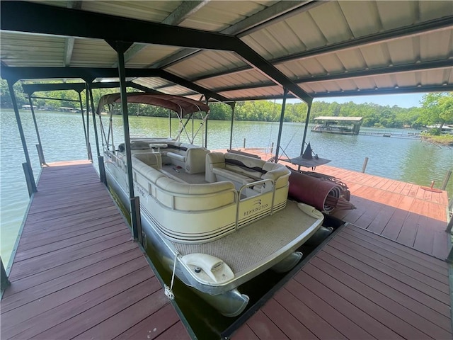 view of dock with a water view and boat lift