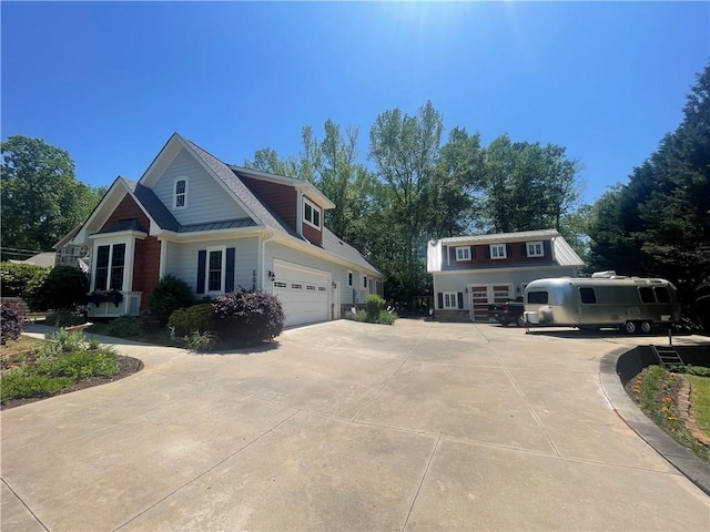 craftsman-style house featuring an attached garage and concrete driveway