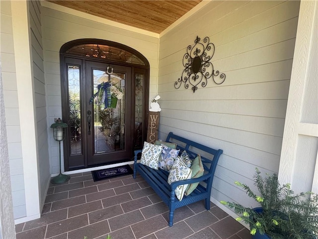 property entrance with covered porch