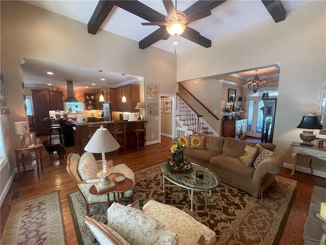 living room with stairs, baseboards, and wood finished floors
