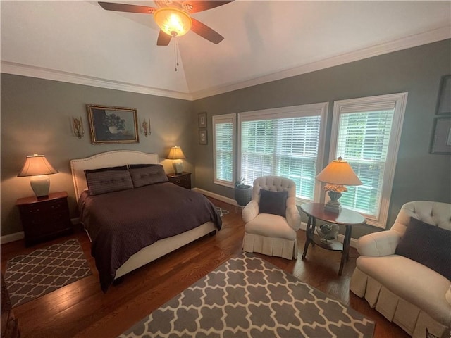 bedroom featuring baseboards, multiple windows, wood finished floors, and lofted ceiling
