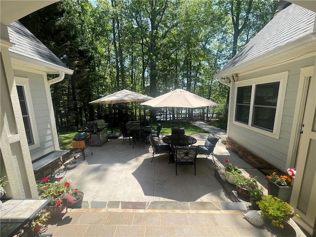 view of patio / terrace featuring outdoor dining area and area for grilling