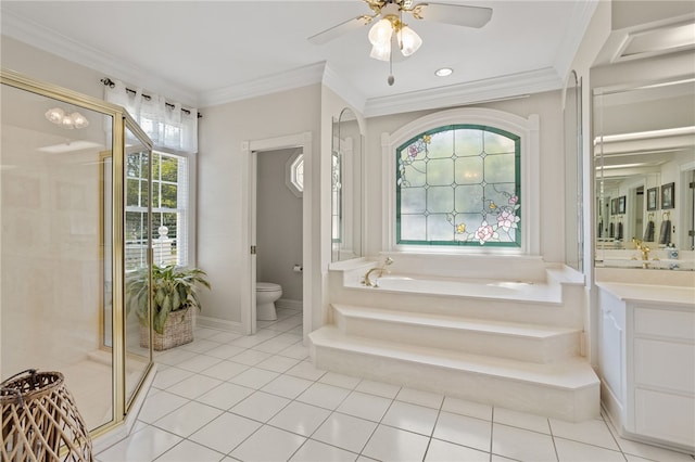 bathroom with tile patterned flooring, toilet, a ceiling fan, a bath, and a stall shower