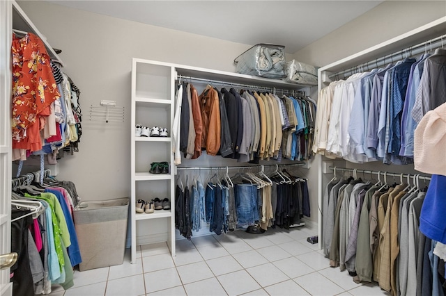 walk in closet featuring tile patterned flooring