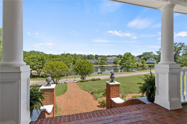 view of patio / terrace with covered porch and a water view