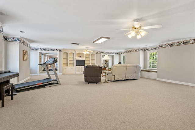living area featuring carpet floors, ceiling fan, baseboards, and visible vents