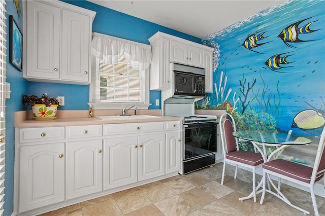 kitchen featuring a sink, white cabinets, range with electric cooktop, and black microwave