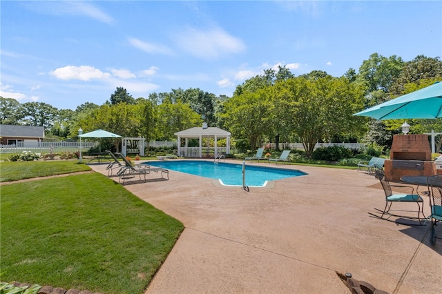 view of pool with a gazebo, fence, a yard, and a patio