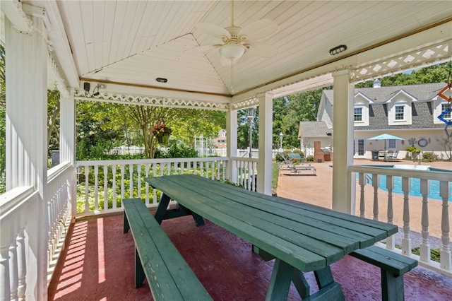 balcony featuring a patio, a ceiling fan, and outdoor dining area