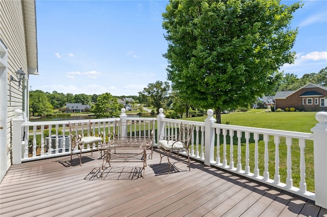 deck featuring a water view and a yard
