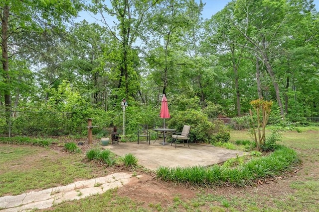 view of yard featuring fence and a patio