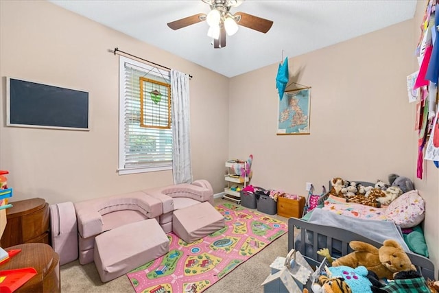 bedroom featuring a ceiling fan and carpet