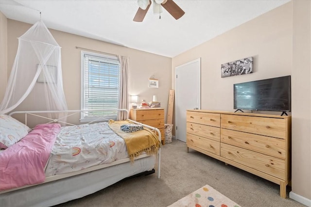 carpeted bedroom featuring a ceiling fan