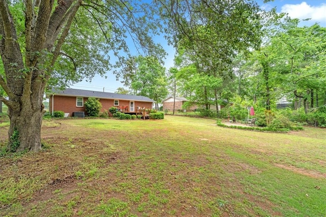view of yard featuring a wooden deck