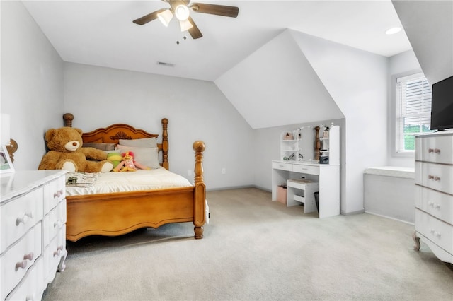 bedroom featuring ceiling fan, lofted ceiling, visible vents, and light colored carpet