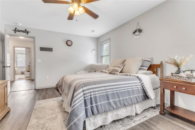 bedroom featuring light wood finished floors and ceiling fan