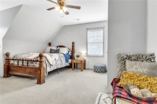 carpeted bedroom with visible vents, a ceiling fan, and lofted ceiling
