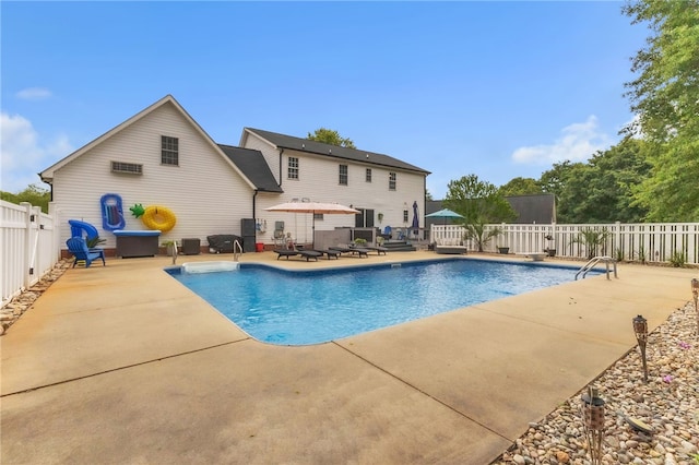 view of pool featuring a patio, a fenced in pool, and a fenced backyard