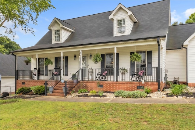 view of front of property with a porch, crawl space, and a front yard