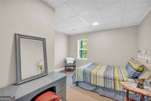 bedroom with a paneled ceiling