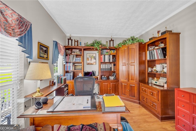office space with light wood-style flooring, a textured ceiling, and ornamental molding