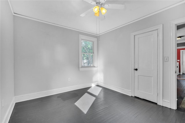 322 Whitehall Rd, Anderson, SC 29625 - spare room with crown molding, baseboards, a ceiling fan, and dark wood-type flooring
