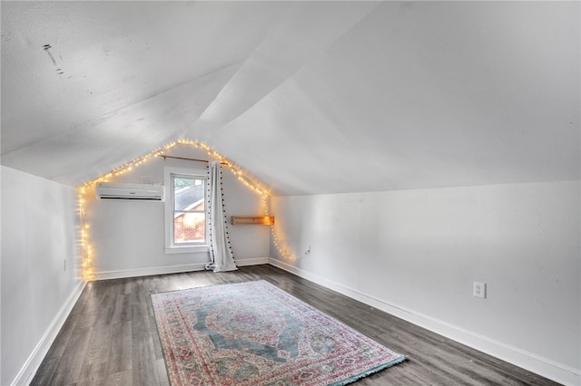 322 Whitehall Rd, Anderson, SC 29625 - bonus room featuring baseboards, a wall unit AC, wood finished floors, and lofted ceiling