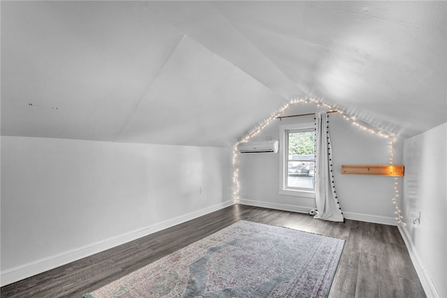 322 Whitehall Rd, Anderson, SC 29625 - additional living space with an AC wall unit, baseboards, wood finished floors, and lofted ceiling