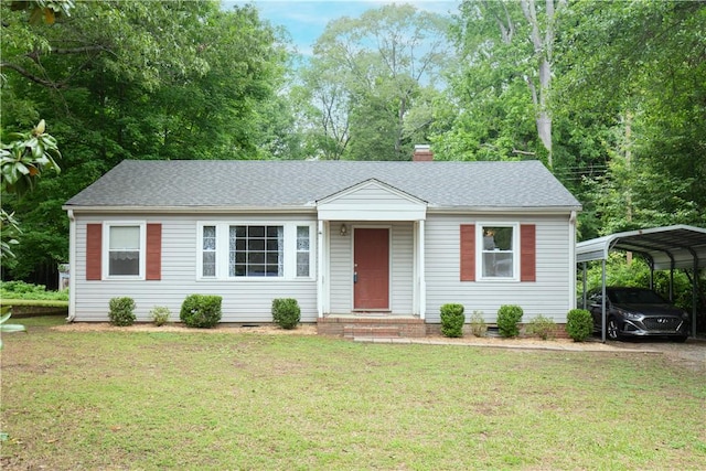 ranch-style house with a shingled roof, a chimney, a front lawn, and a carport