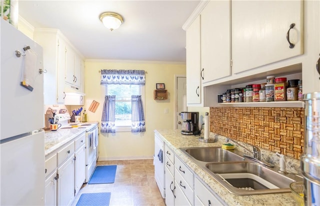 kitchen featuring a sink, under cabinet range hood, white appliances, and light countertops