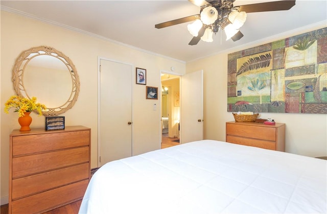 bedroom featuring a ceiling fan, ornamental molding, and wood finished floors